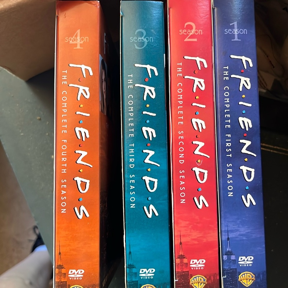 Friends DVDs Seasons 1, 2, 3, and 4.